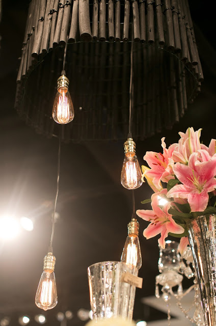 Accent Decor showroom chandelier from fiber sticks and Edison bulbs