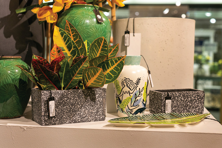 A close up image of Accent Decor planters and home decor accessories within a showroom installation.