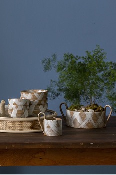 Levy Collection styled atop a wooden table.