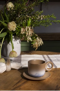 Smooth Mug artfully placed atop a breakfast table.