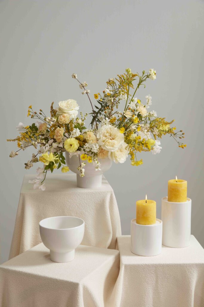 Accent Decor's Eco-Friendly Floral  Orion Compote atop a white pedestal. 