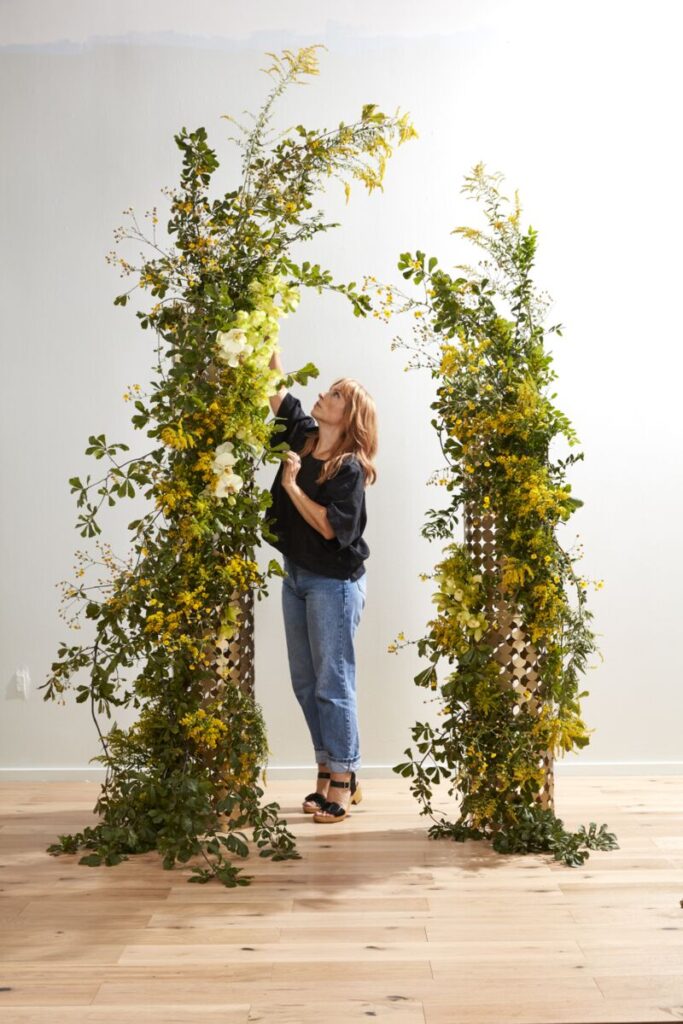 Image of Sue McLeary, Passionflower Sue, designing into arch decor wedding.