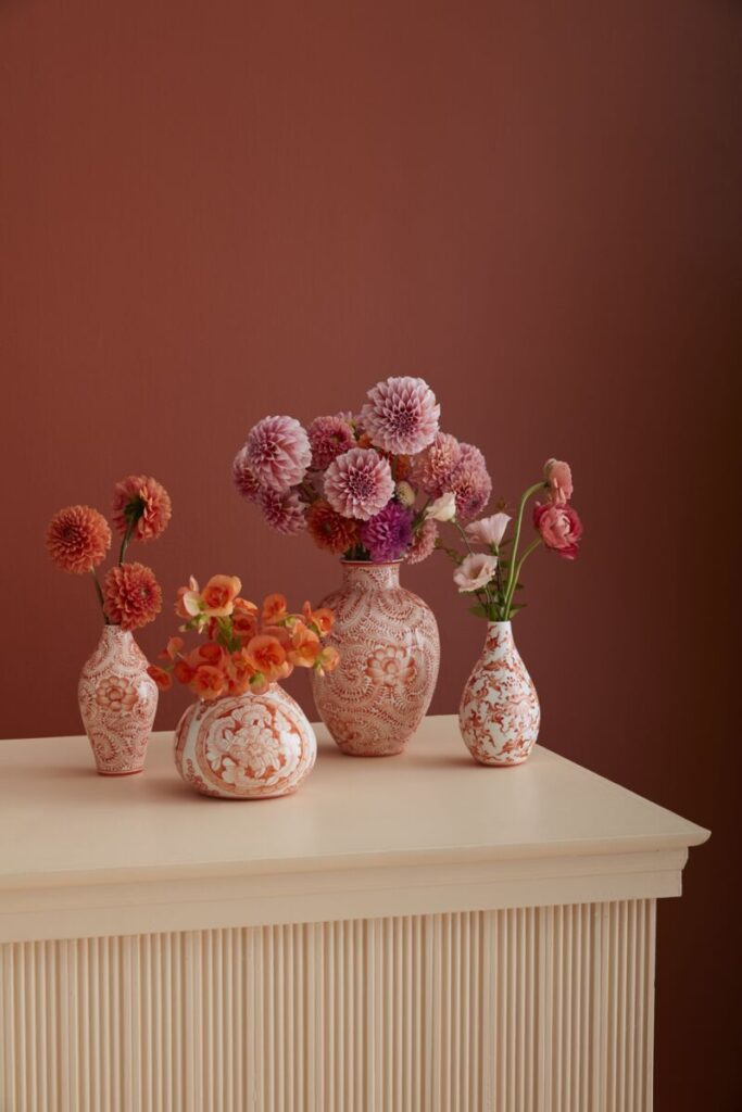 The Eleanor Chinoiserie Vase Collection from Accent Decor, styled with fresh flowers on a tabletop.