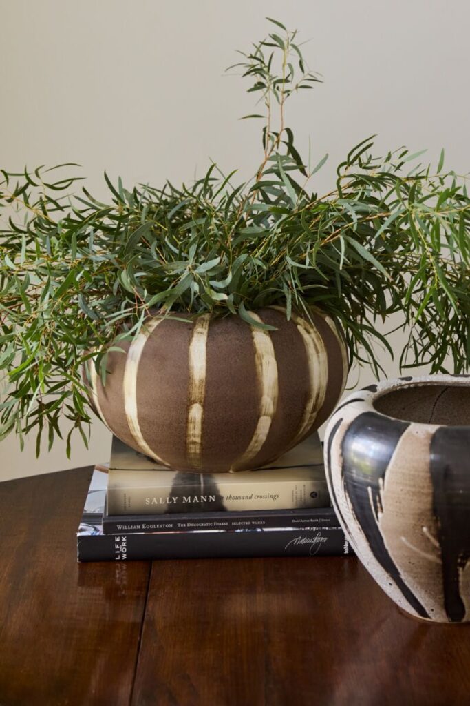 Image of the Atwood Vase, a wholesale home accent from the wholesale decor supplier Accent Decor, displayed atop a table.