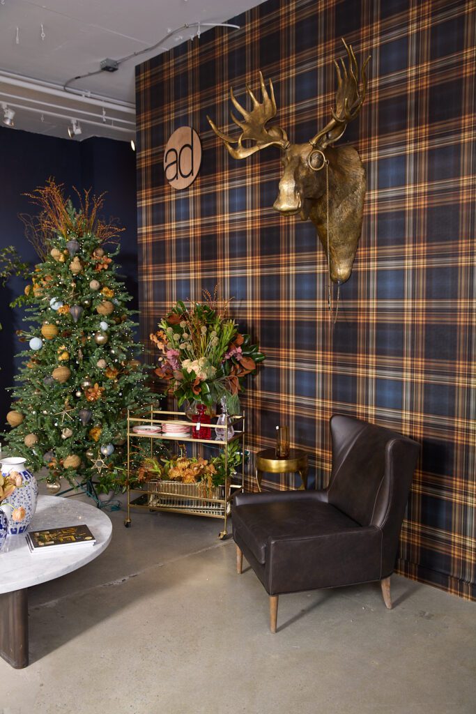 A corner within Accent Decor's High Point Market Showroom ft. holiday decor and the E+E Eugene Wall Mount.