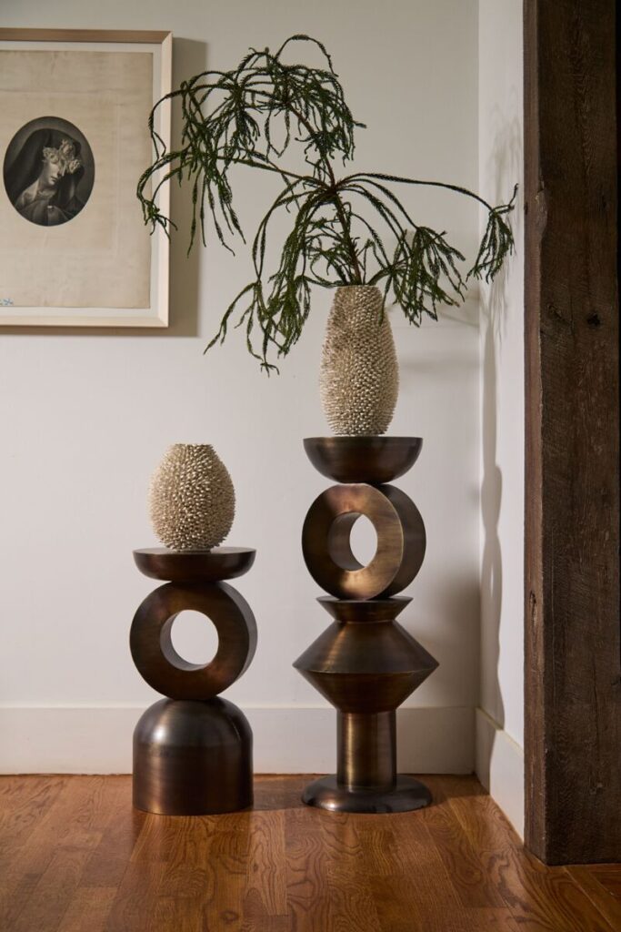 The Accent Decor Echelon Columns styled in a home corner. 