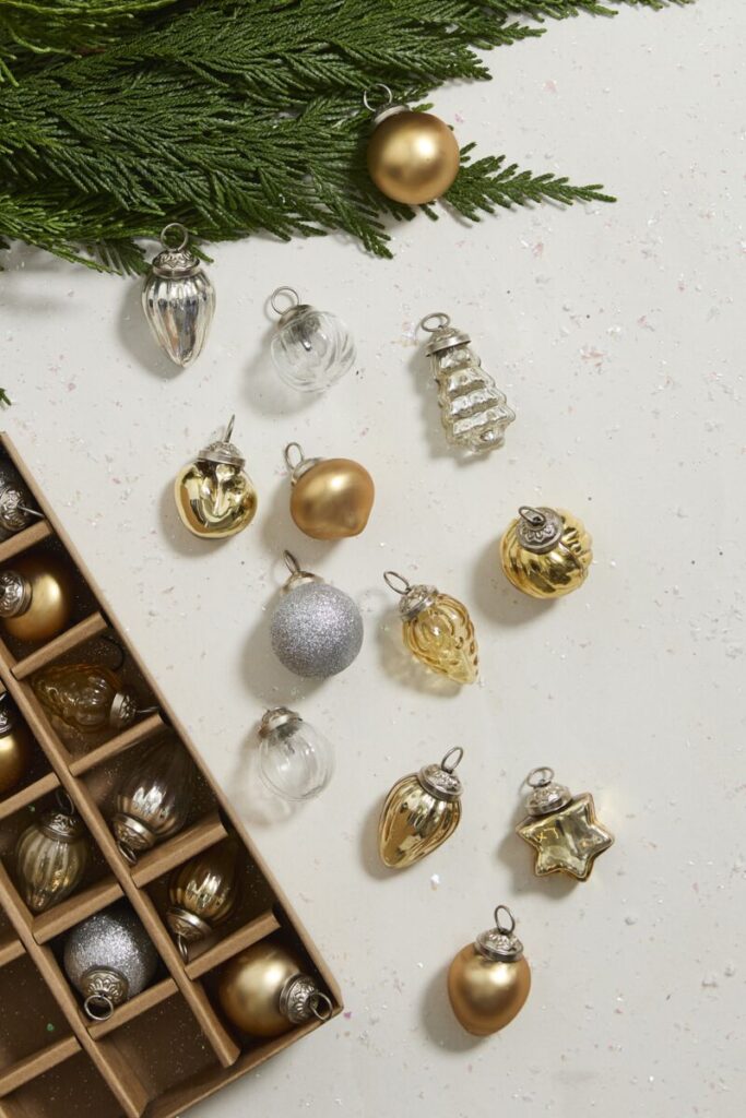 Accent Decor's Aetheris Ornament Set ft. gold and silver ornaments. 
