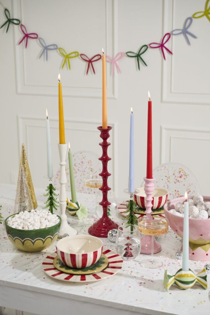 A brightly decorated tablescape ft. Accent Decor's Deck the Hall Collection of colorful plates and bowls.