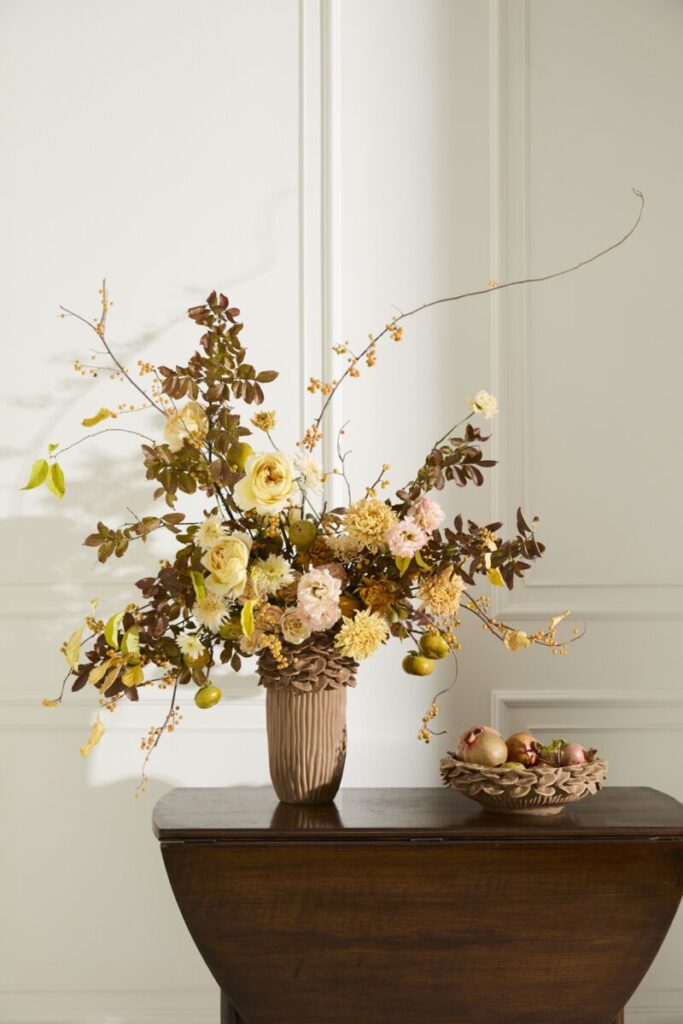 Accent Decor's Petal Mushroom Collection styled with dried florals atop a table. 