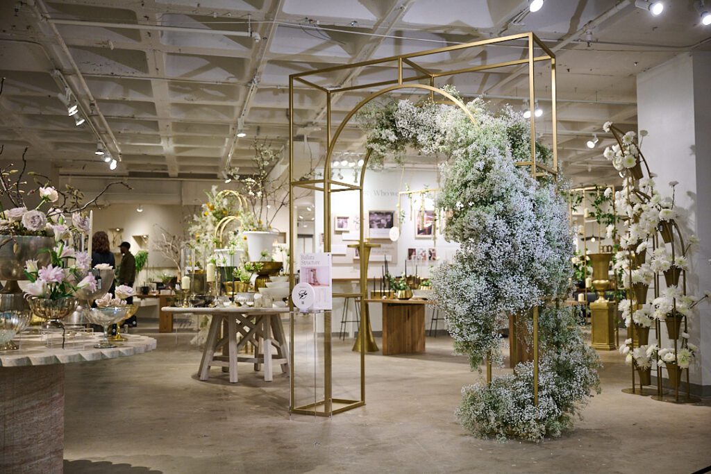 Large arch decor wedding ft. lush floral arrangements within the Accent Decor showroom. 