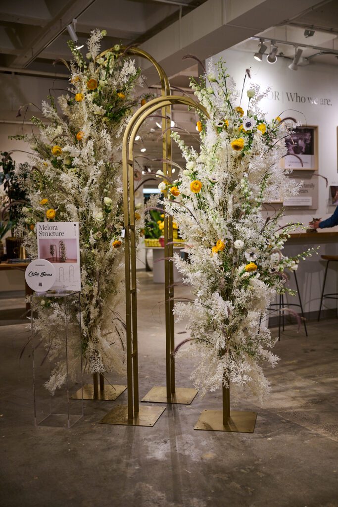 Large arch decor wedding ft. lush florals within the Accent Decor showroom. 