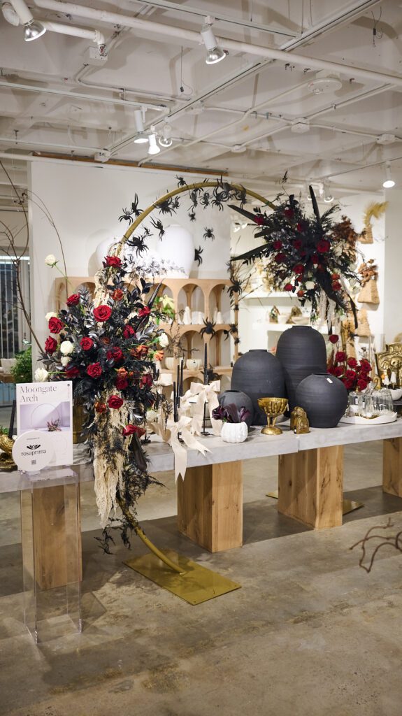 Large arch decor wedding ft. lush red florals within the Accent Decor showroom. 