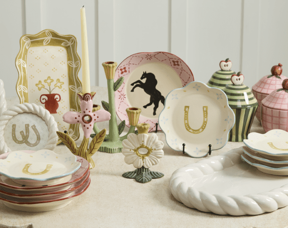 Styled assortment of products including canisters, candleholders and more.