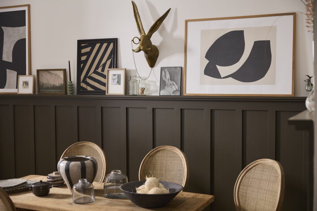 Stylish dining room with an Eric + Eloise Wall Mount directly above a table.