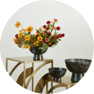 photo of a few of wholesale compote products featured on several side tables